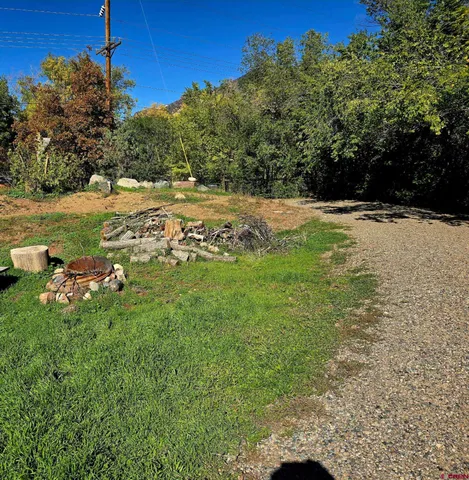 a view of swimming pool with a yard