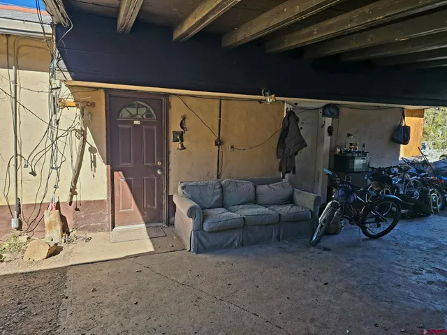 a view of a workspace with furniture