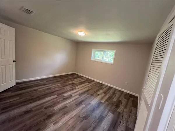 a view of an empty room and window