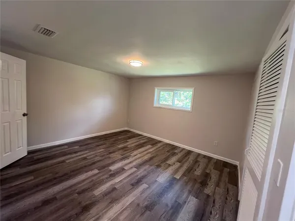 a white toilet and a shower in a bathroom