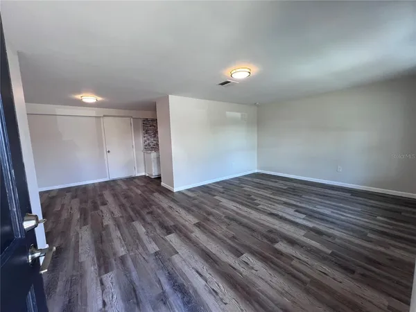 a kitchen with stove and refrigerator