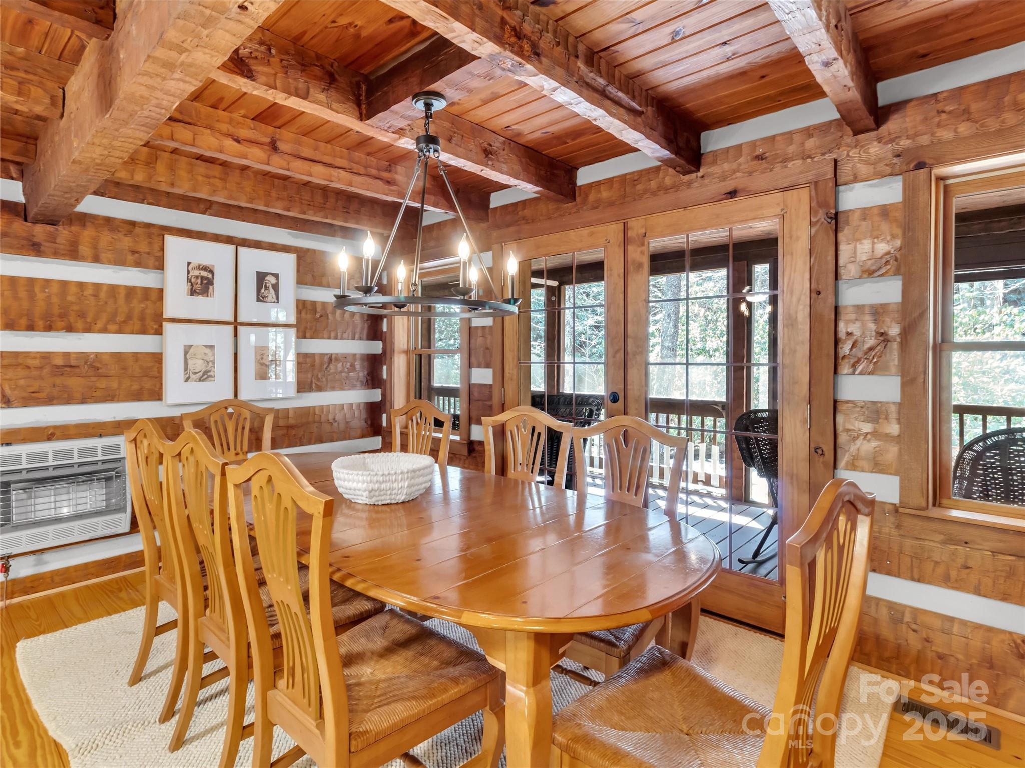 7810 Little Snowbird Road Robbinsville, NC 28771 - Photo 16 of 48 a dining room with furniture and wooden floor