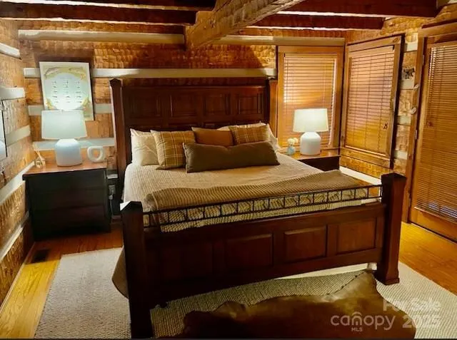 a bedroom with a bed and window