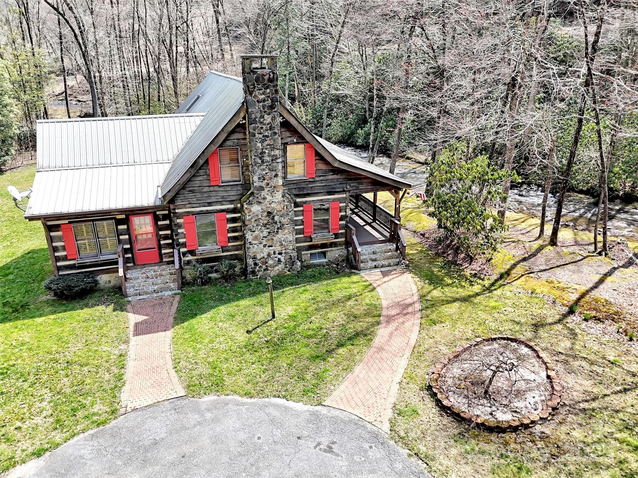 7810 Little Snowbird Road Robbinsville, NC 28771 - Photo 2 of 48 a view of small yard in front of house