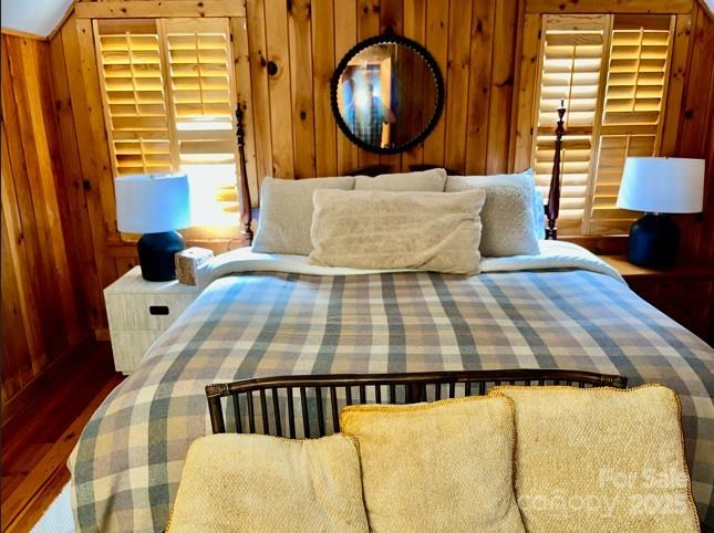 7810 Little Snowbird Road Robbinsville, NC 28771 - Photo 24 of 48 a bedroom with a bed and dresser next to a window