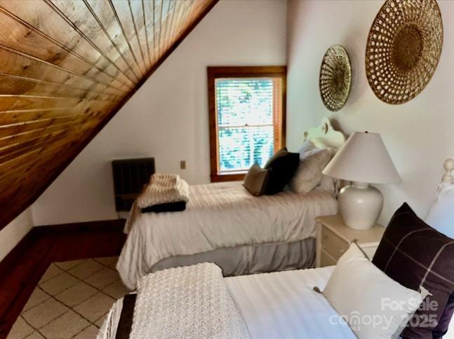 7810 Little Snowbird Road Robbinsville, NC 28771 - Photo 26 of 48 a bedroom with a bed and window