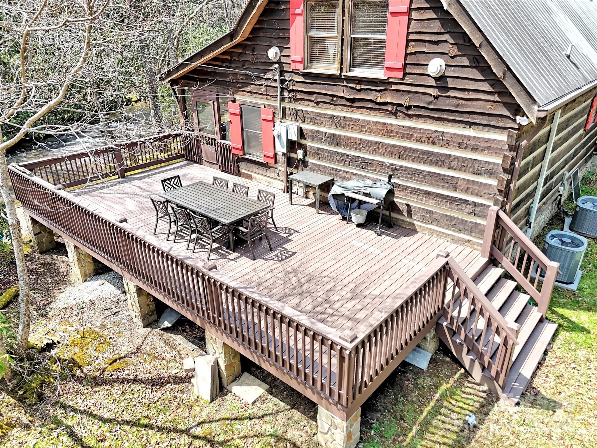 7810 Little Snowbird Road Robbinsville, NC 28771 - Photo 29 of 48 a roof deck with a chair and table