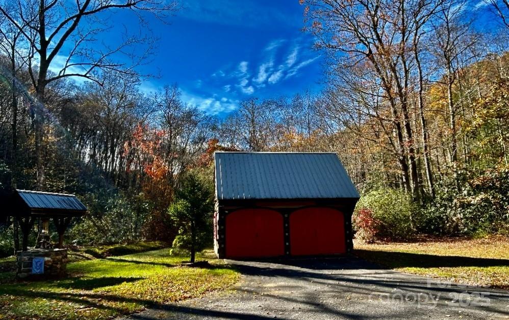 7810 Little Snowbird Road Robbinsville, NC 28771 - Photo 32 of 48 a view of a house with a yard
