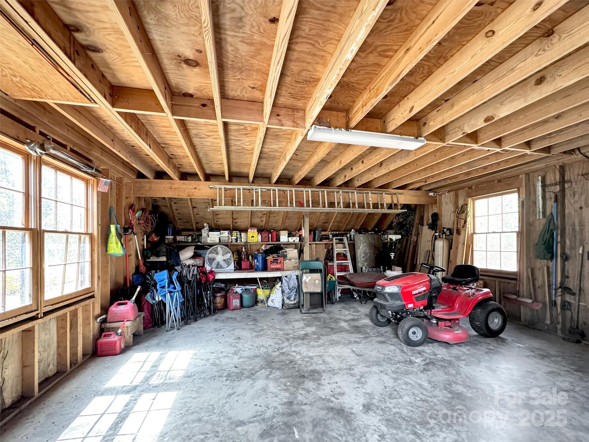 7810 Little Snowbird Road Robbinsville, NC 28771 - Photo 33 of 48 a view of a garage with a car and a car