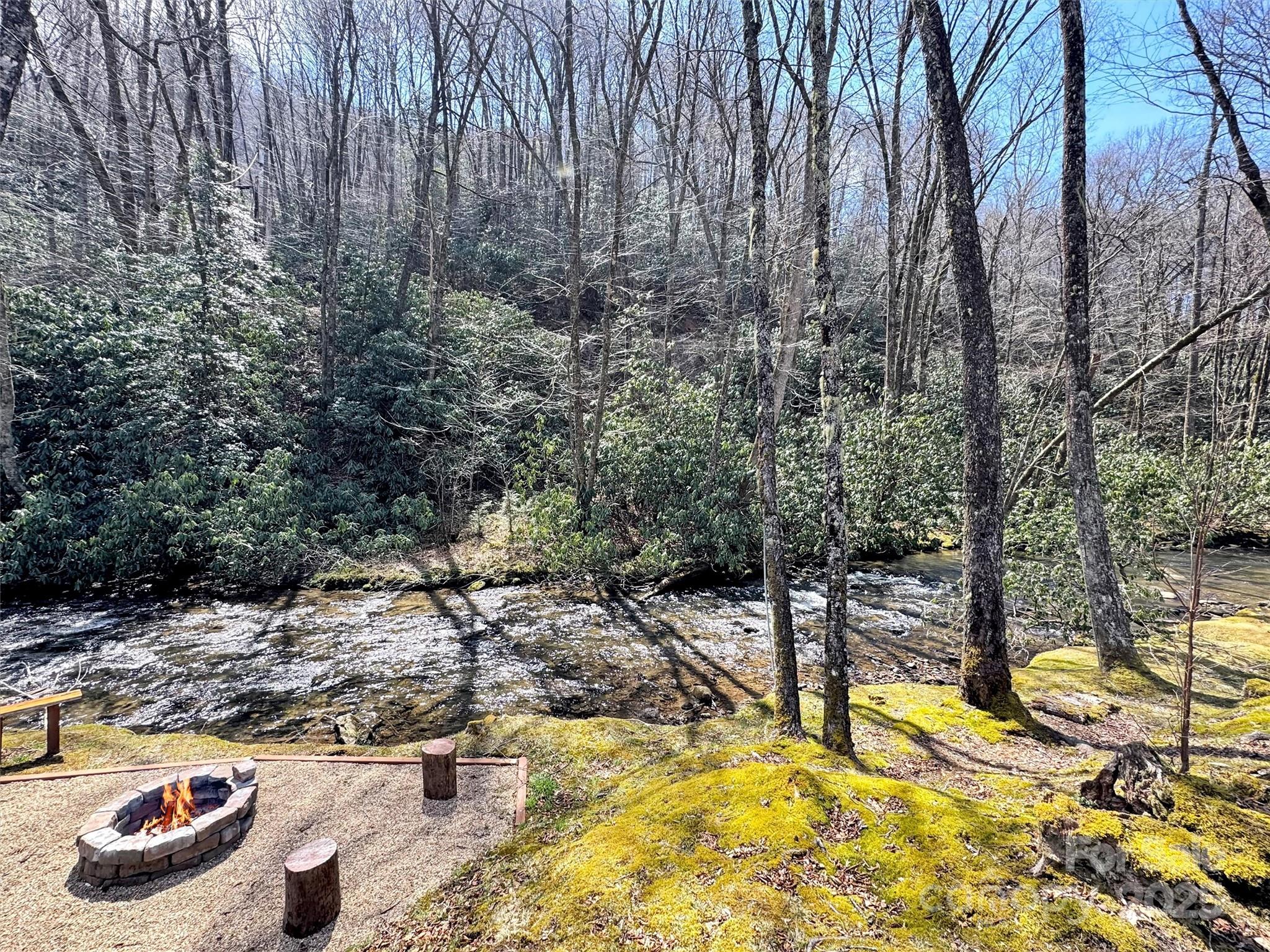 7810 Little Snowbird Road Robbinsville, NC 28771 - Photo 41 of 48 a view of a swimming pool with a yard