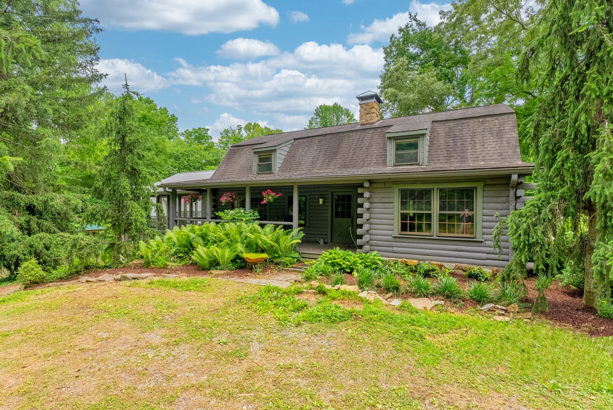 7803 Covington Road White House, TN 37188 - Photo 5 of 55 a view of a house with a yard and potted plants