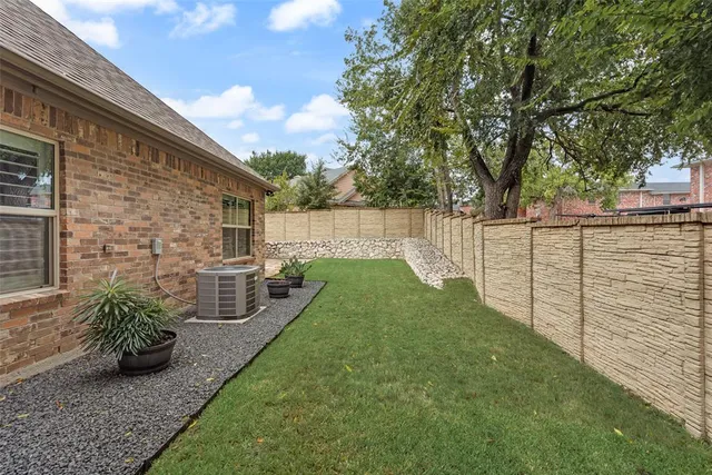 a view of a backyard with sitting area