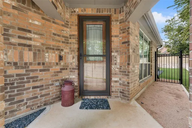 a view of a door and a window