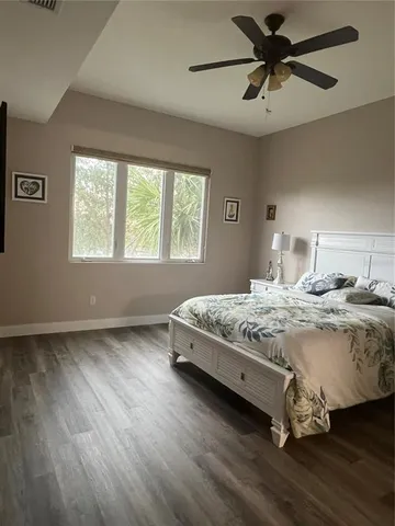 a bedroom with bed and window