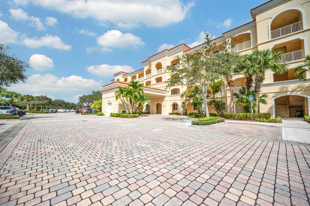 37 Harbour Isle Drive East, Unit 206 Fort Pierce, FL 34949 - Photo 28 of 37 a view of a building with a street