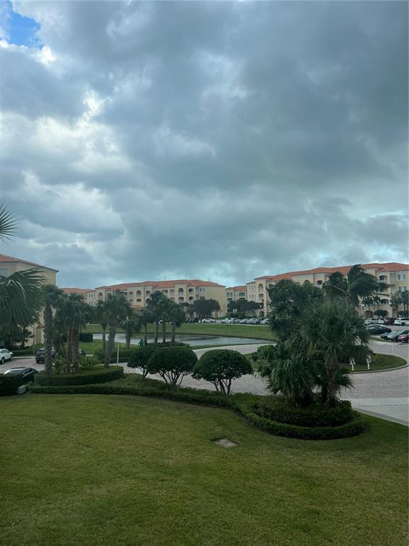 37 Harbour Isle Drive East, Unit 206 Fort Pierce, FL 34949 - Photo 30 of 37 a view of a lake with a big yard