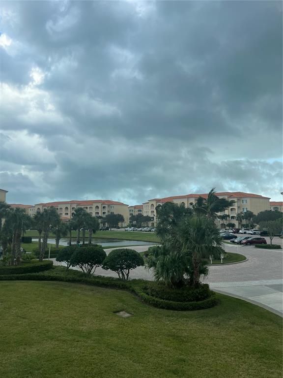 37 Harbour Isle Drive East, Unit 206 Fort Pierce, FL 34949 - Photo 31 of 37 a view of a lake with a big yard