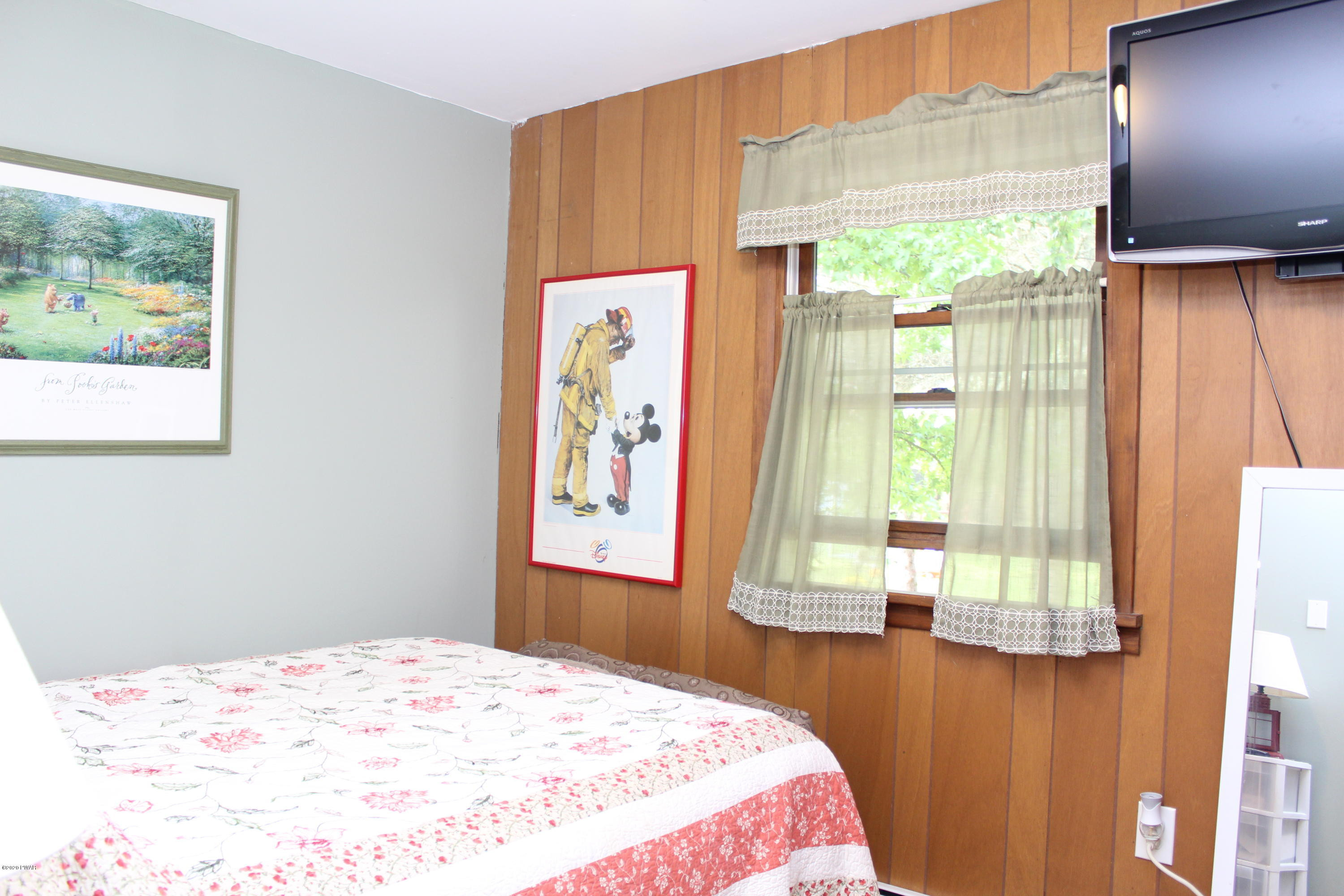 798 Goose Pond Road Lake Ariel, PA 18436 - Photo 22 of 47 a bedroom with a bed and a window