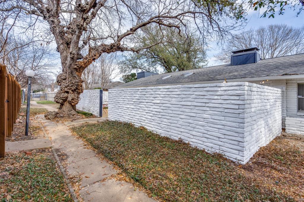 15642 Overmead Circle Dallas, TX 75248 - Photo 22 of 24 a view of a yard with a tree