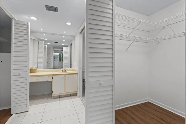 a bathroom with a sink a mirror and a bathtub