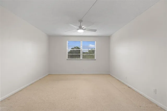 an empty room with closet area