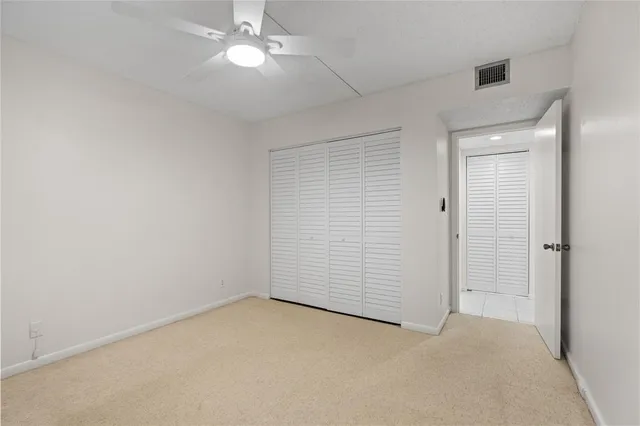 an empty room with fan