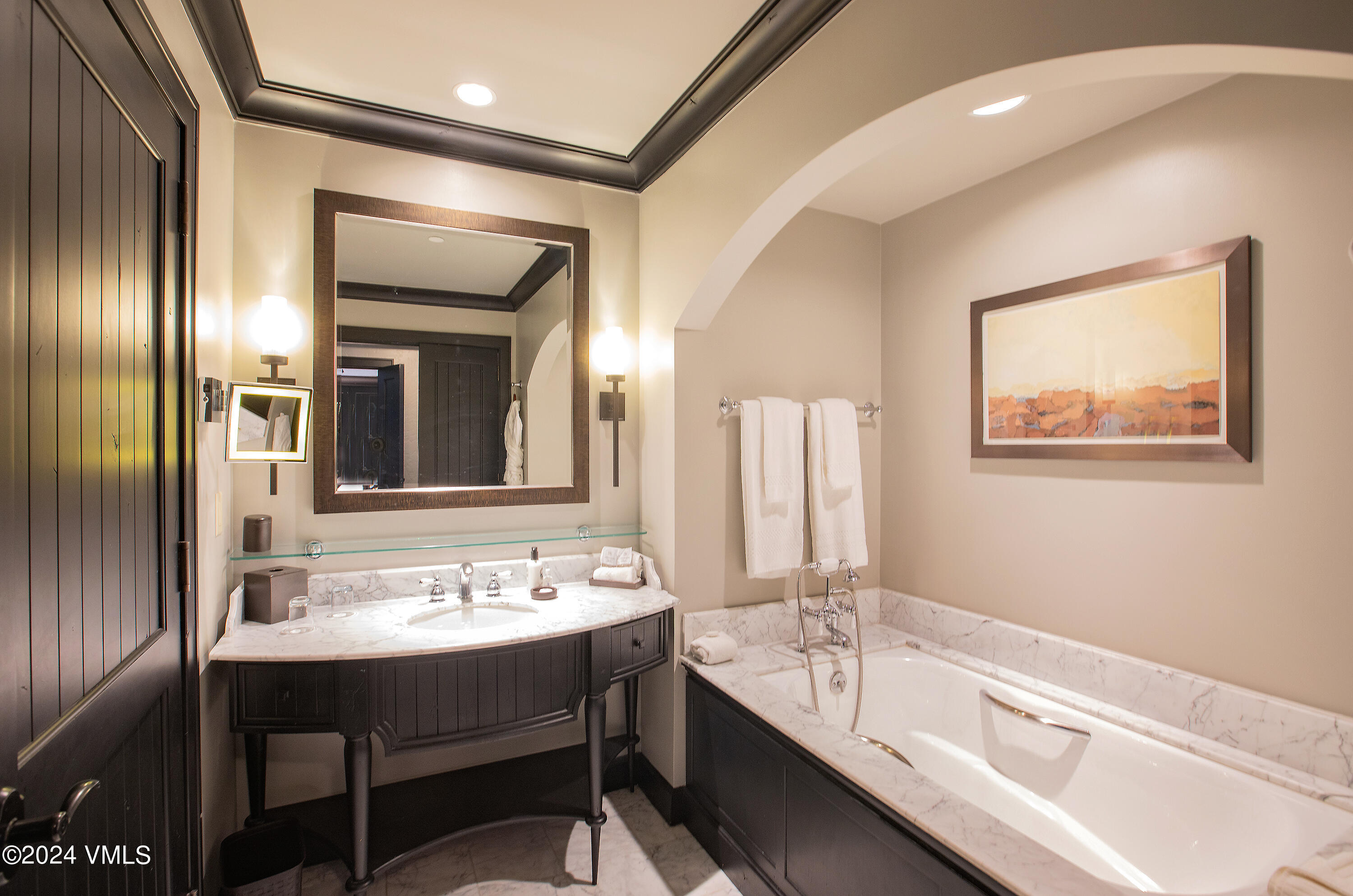 130 Daybreak Ridge Road, Unit HS658/660 Avon, CO 81620 - Photo 11 of 27 a bathroom with a sink and a mirror