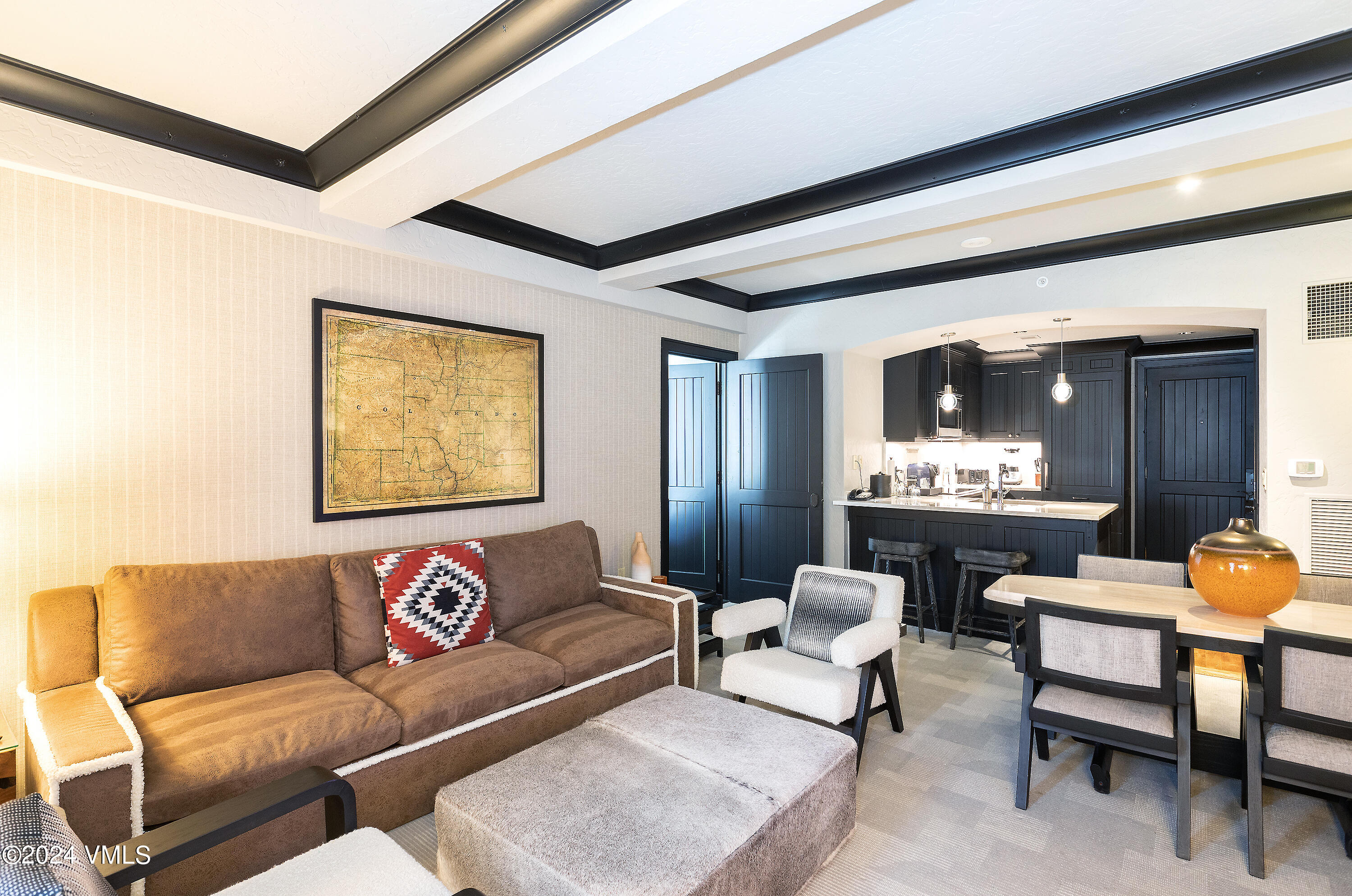130 Daybreak Ridge Road, Unit HS658/660 Avon, CO 81620 - Photo 13 of 27 a living room with furniture and a large window