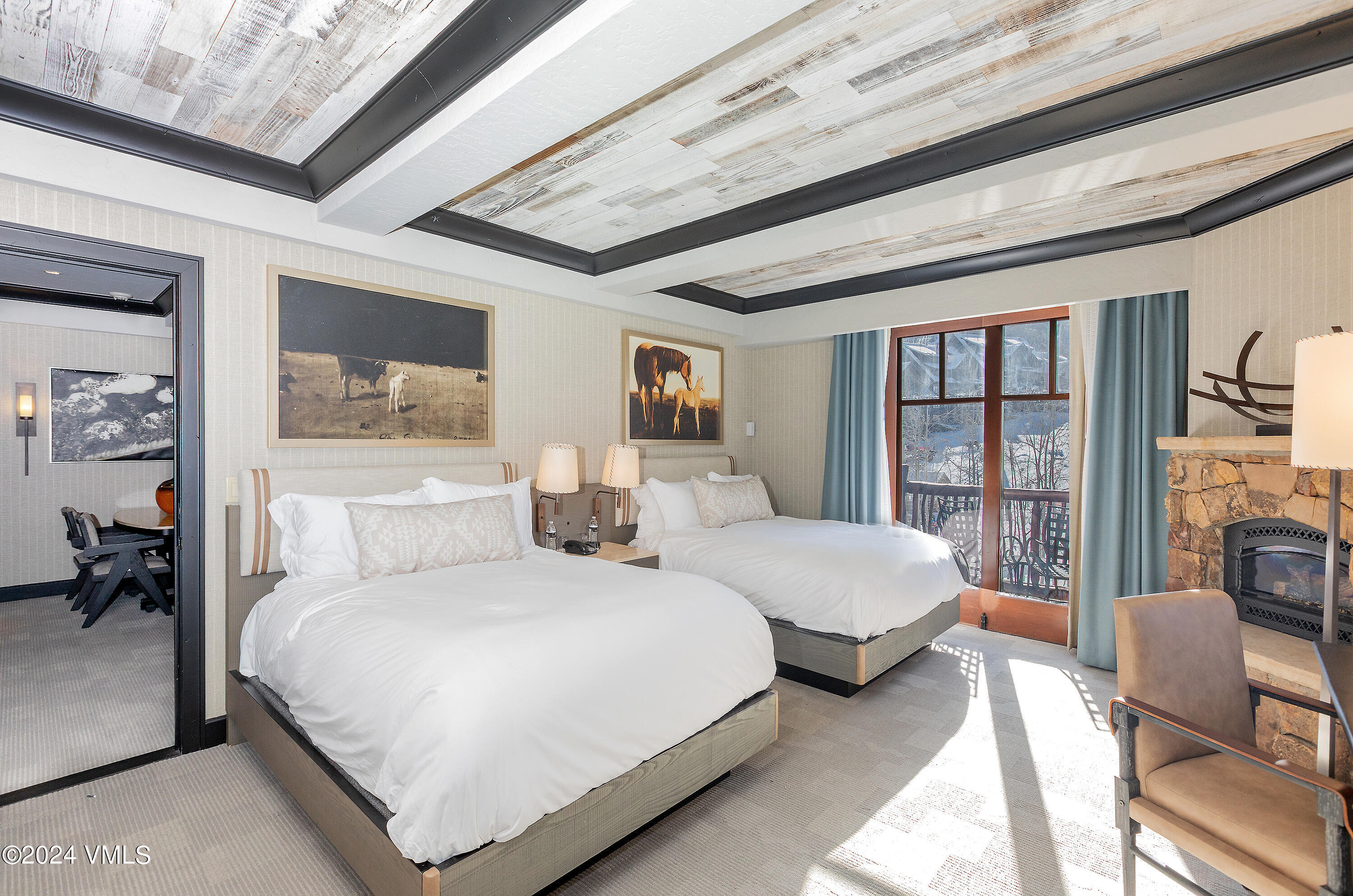 130 Daybreak Ridge Road, Unit HS658/660 Avon, CO 81620 - Photo 14 of 27 a bedroom with double bed furniture and a large window