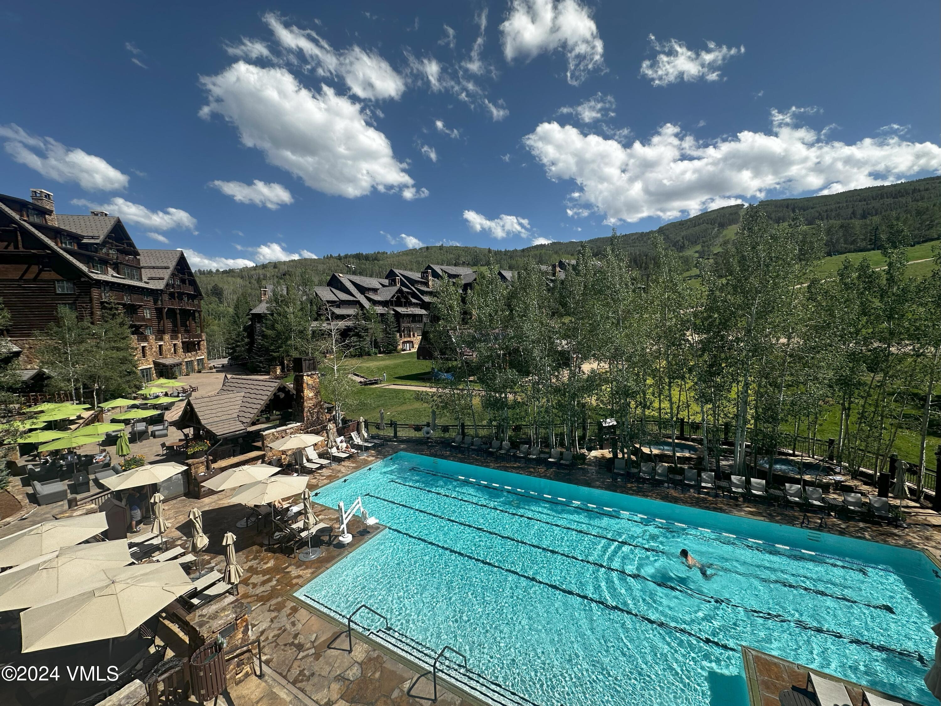 130 Daybreak Ridge Road, Unit HS658/660 Avon, CO 81620 - Photo 2 of 27 a view of a fountain with a yard