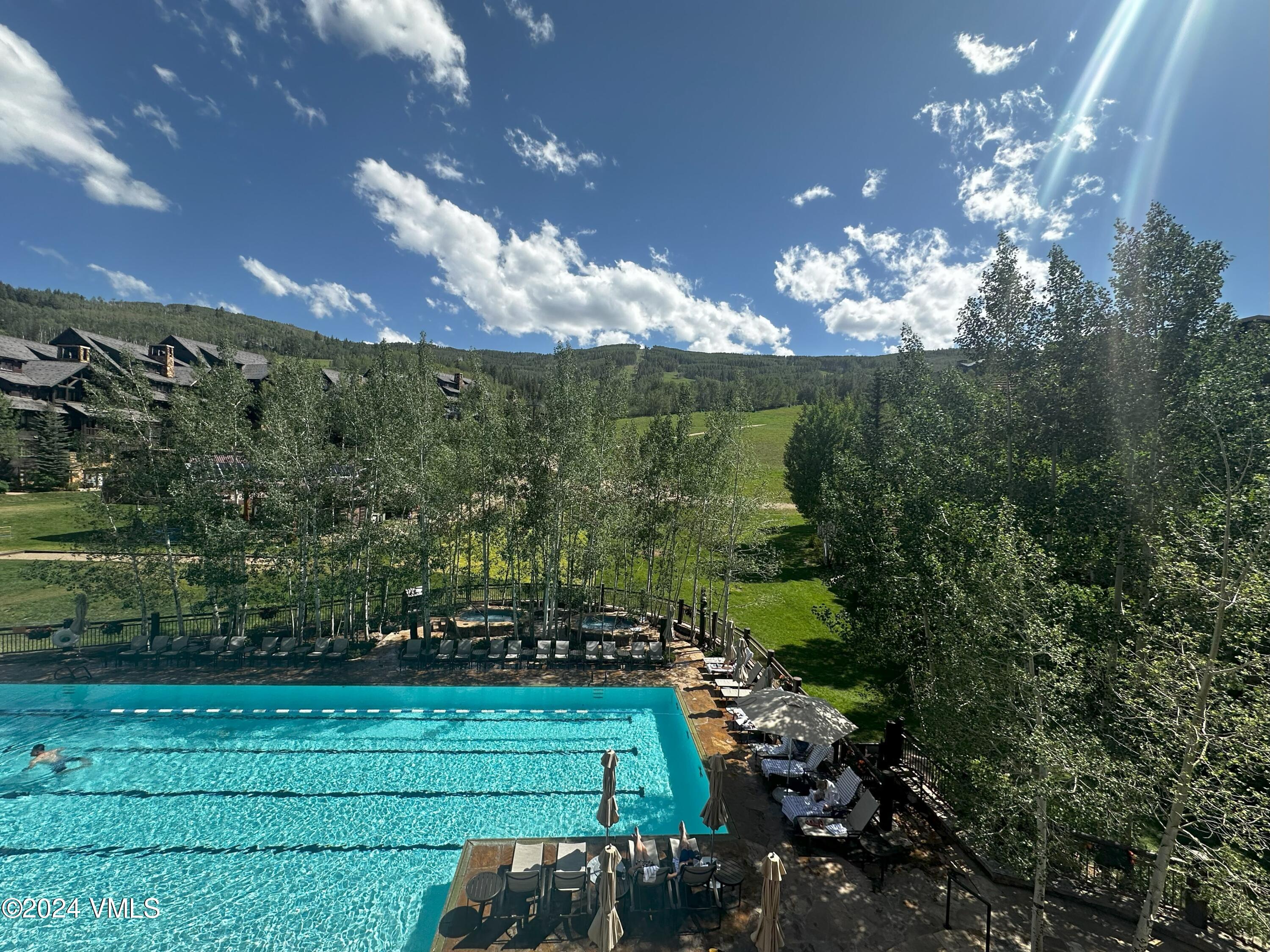 130 Daybreak Ridge Road, Unit HS658/660 Avon, CO 81620 - Photo 23 of 27 a view of a house with a yard