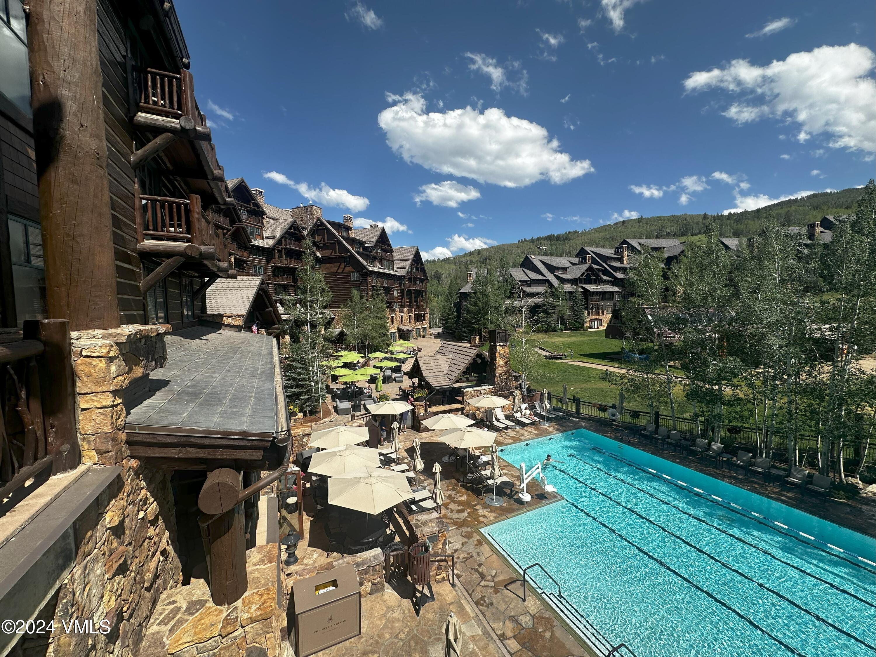 130 Daybreak Ridge Road, Unit HS658/660 Avon, CO 81620 - Photo 26 of 27 a view of a balcony with chairs and a table