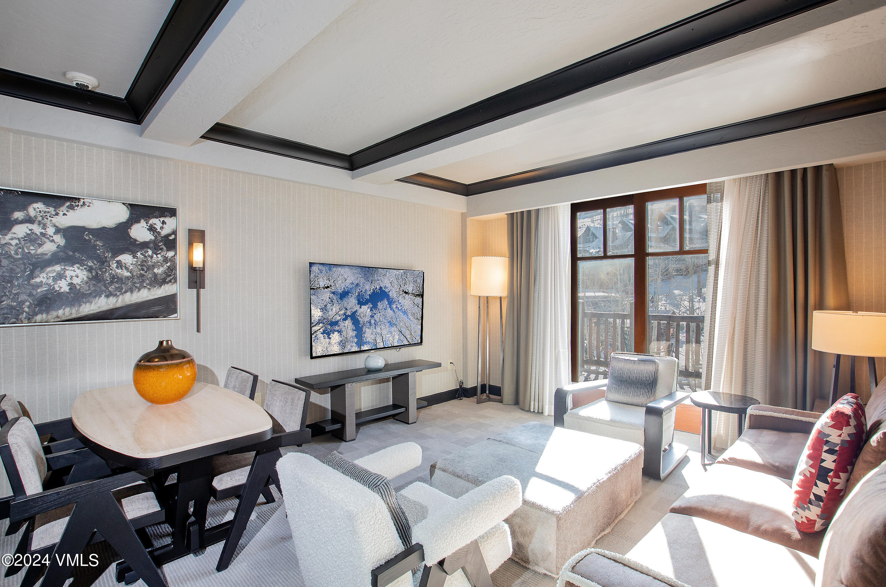 130 Daybreak Ridge Road, Unit HS658/660 Avon, CO 81620 - Photo 5 of 27 a living room with furniture a window and a table