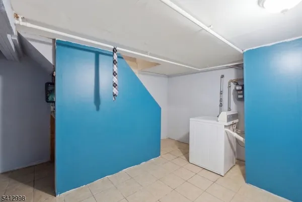 a view of a hallway with storage and utility room