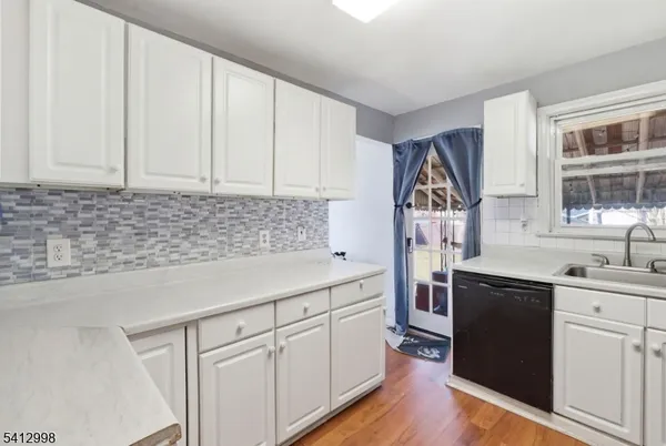 a kitchen with a sink and cabinets