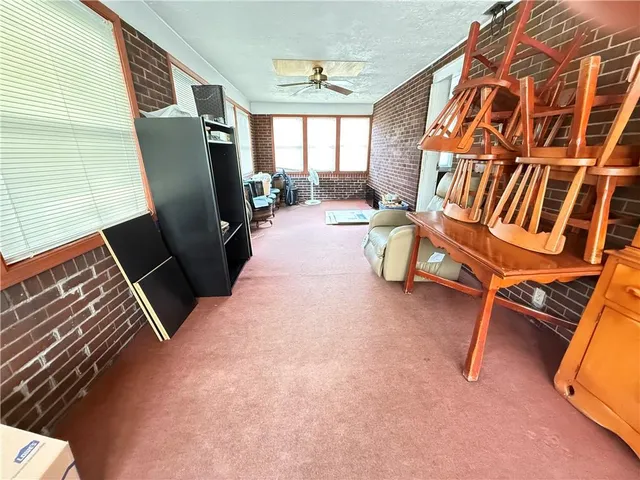 a view of living room with furniture and a window