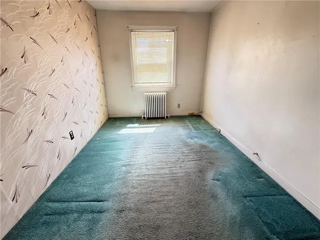 an empty room with a bench