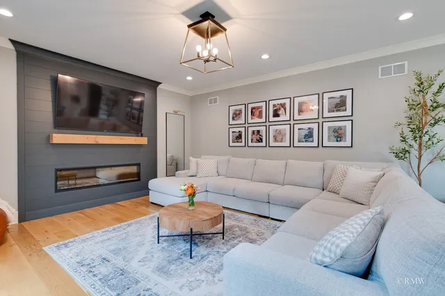 a living room with furniture and a rug