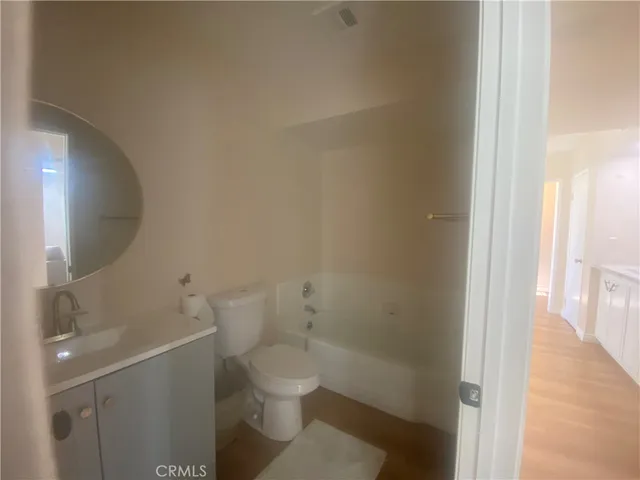 a view of a bathroom from a hallway
