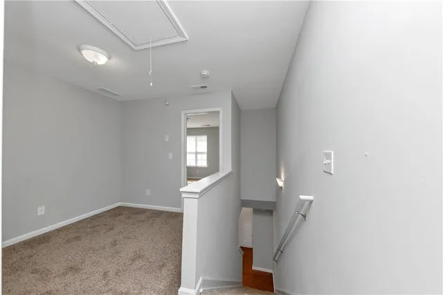 a view of entryway and hall with a window