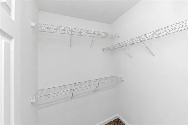 a bathroom with a tub sink and vanity