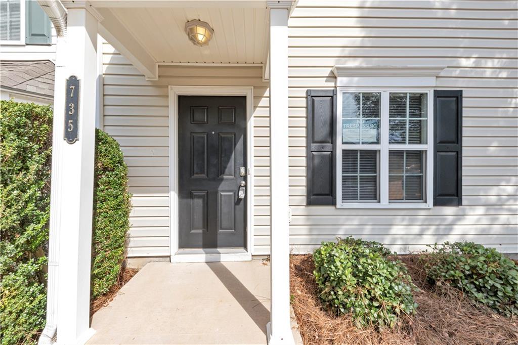 735 Crestwell Circle Atlanta, GA 30331 - Photo 2 of 31 a front view of a house with a yard