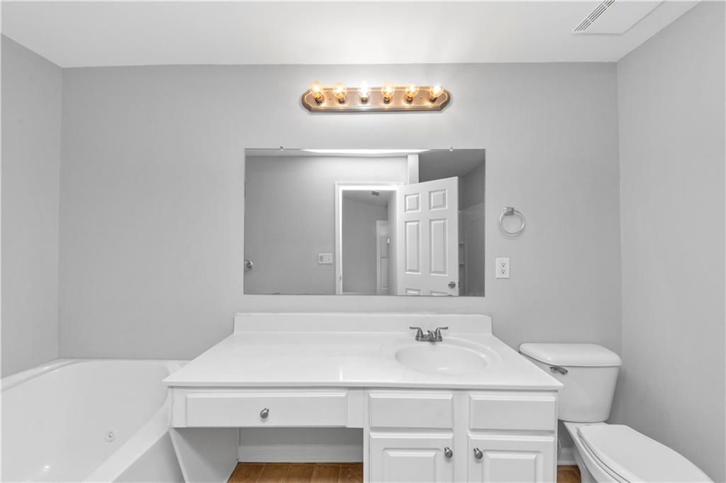735 Crestwell Circle Atlanta, GA 30331 - Photo 21 of 31 a bathroom with a sink and a toilet