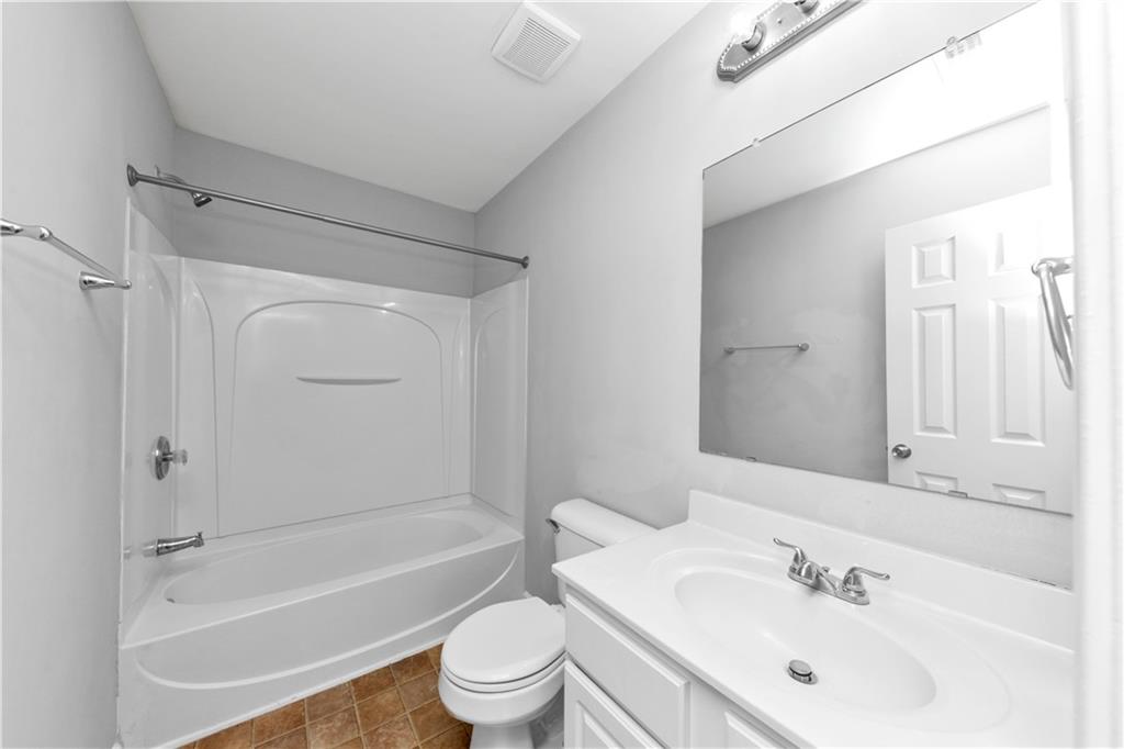 735 Crestwell Circle Atlanta, GA 30331 - Photo 27 of 31 a bathroom with a sink toilet and shower