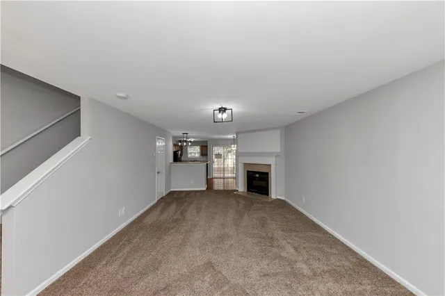 a view of a kitchen with a sink and a window