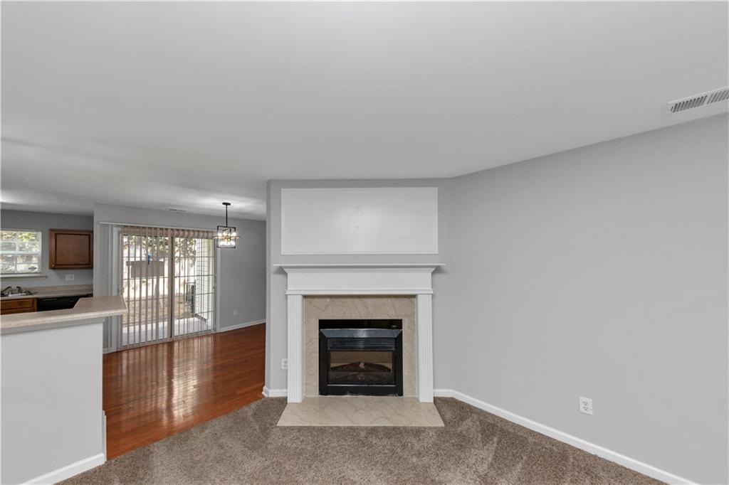 735 Crestwell Circle Atlanta, GA 30331 - Photo 6 of 31 a living room with furniture and a fireplace