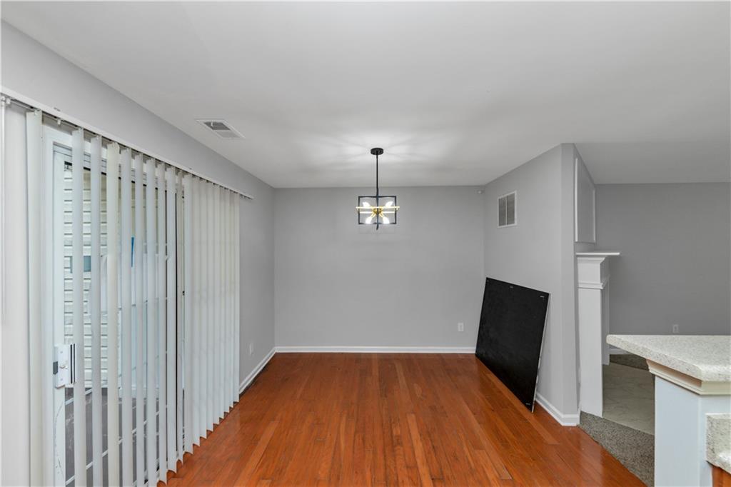 735 Crestwell Circle Atlanta, GA 30331 - Photo 8 of 31 a view of empty room with wooden floor and fan