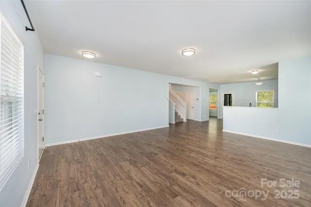 a view of a livingroom with wooden floor