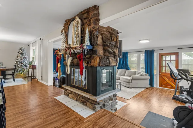a view of a livingroom with furniture and a flat screen tv