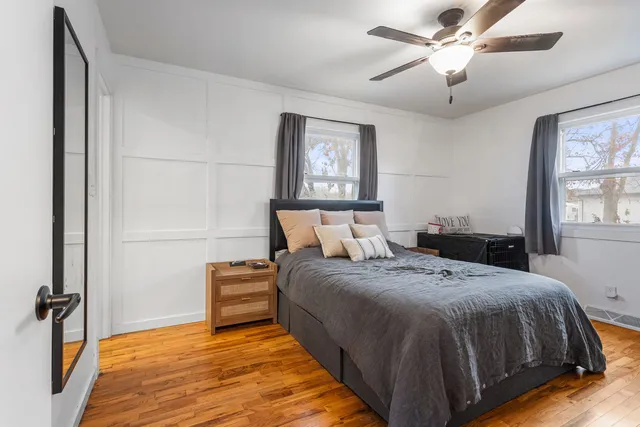 a bedroom with bed and window